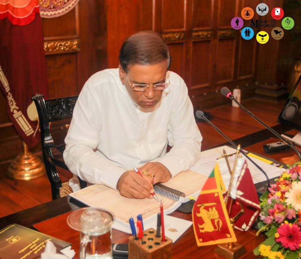 The President signs the March 12 Statement.